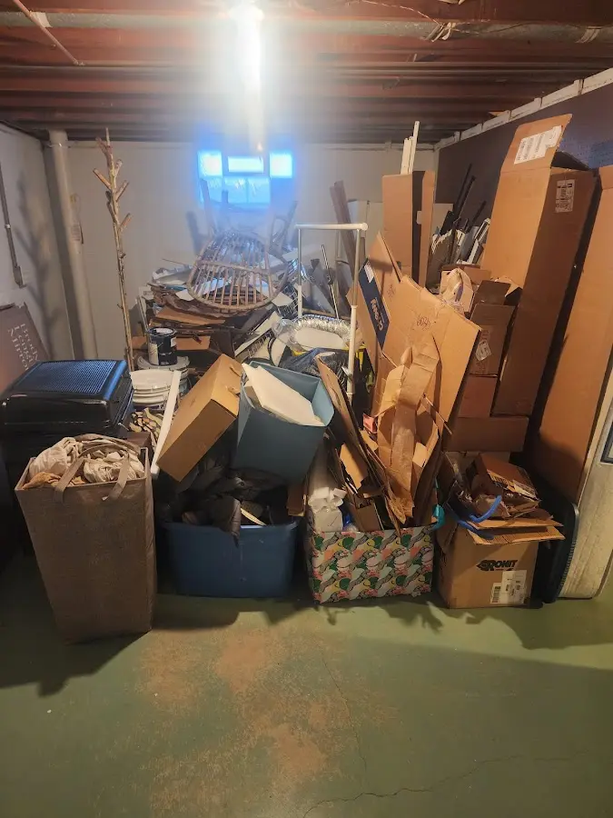 Roll-off dumpster container at job site for 2 Yard Dumpster Rental in Middlebury